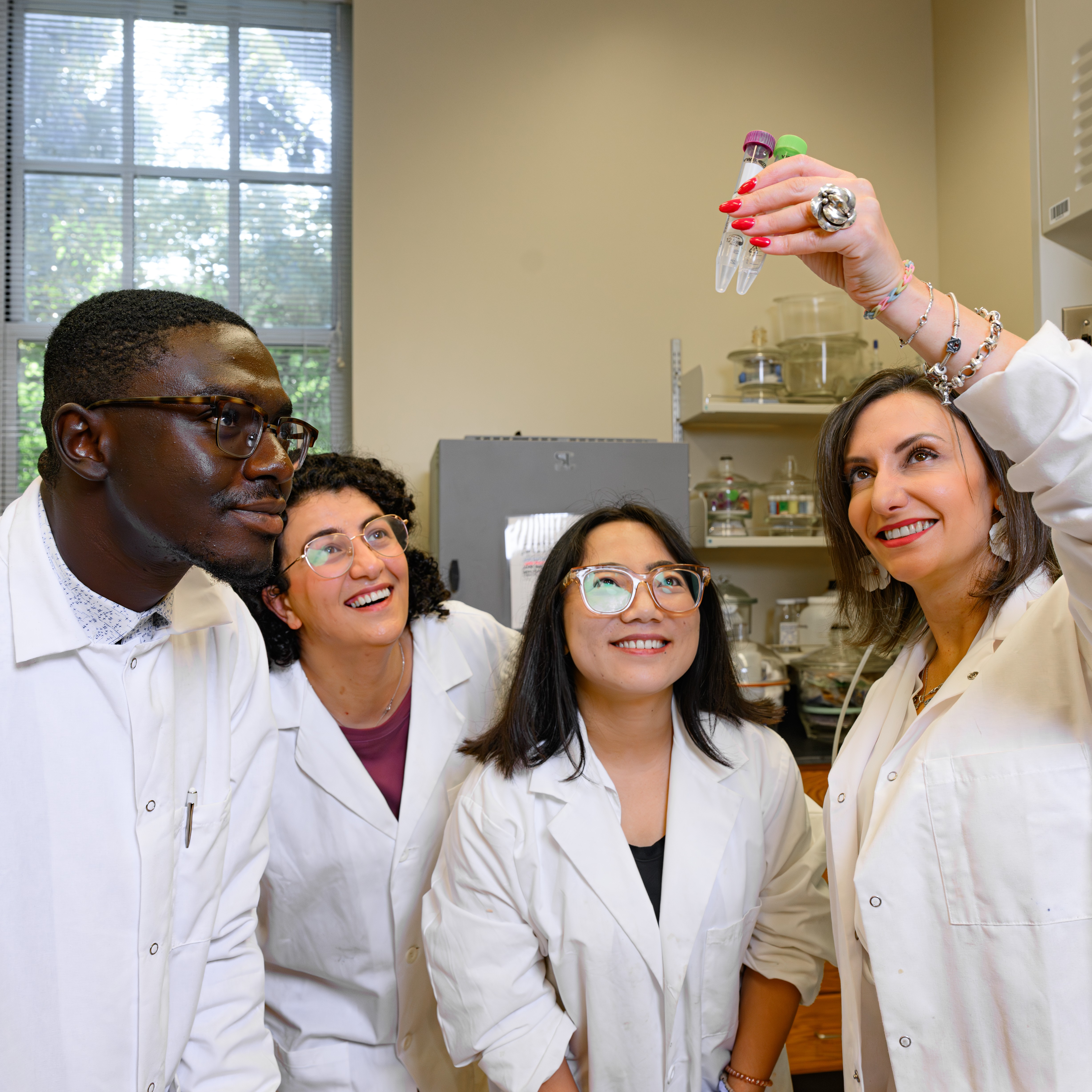 researchers looking at a sample