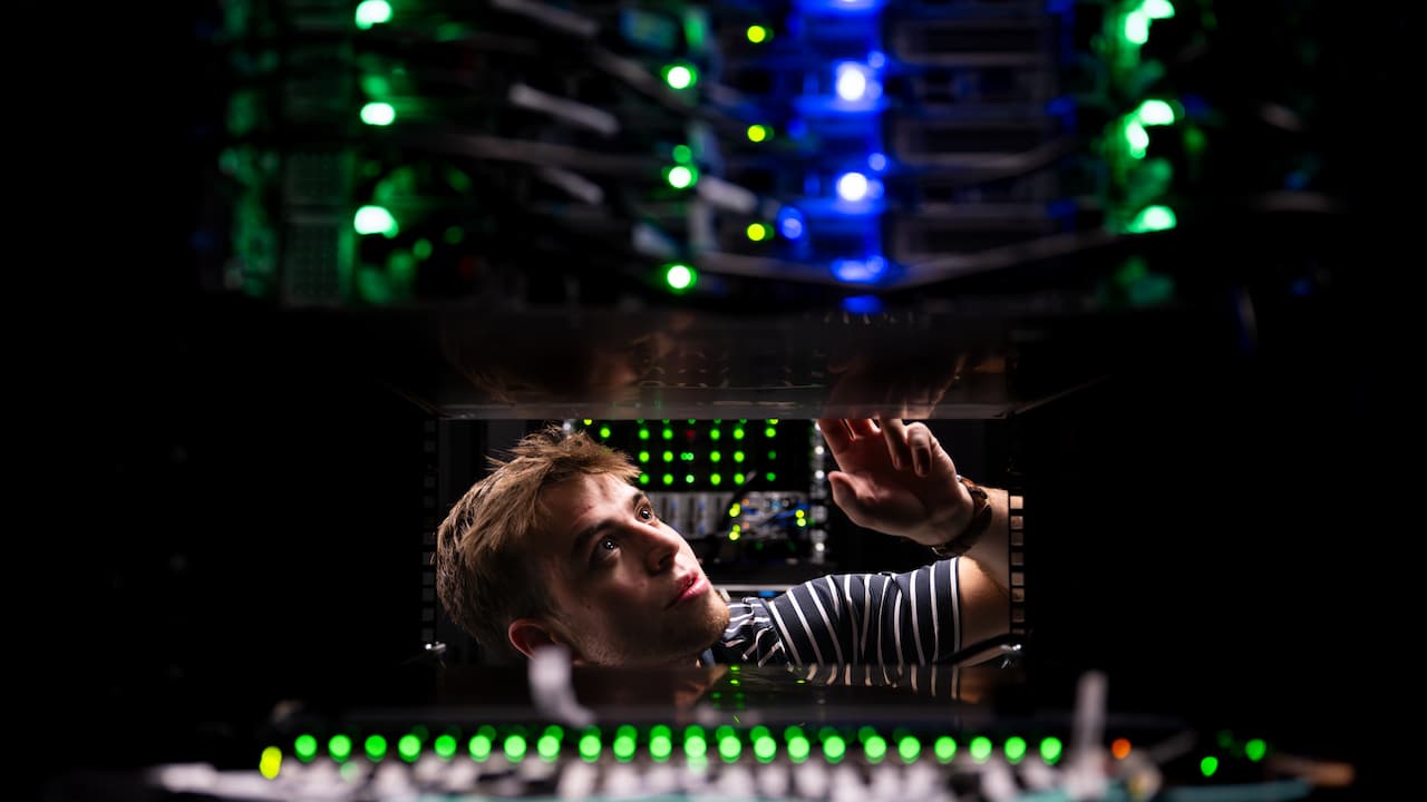 student working in a server room