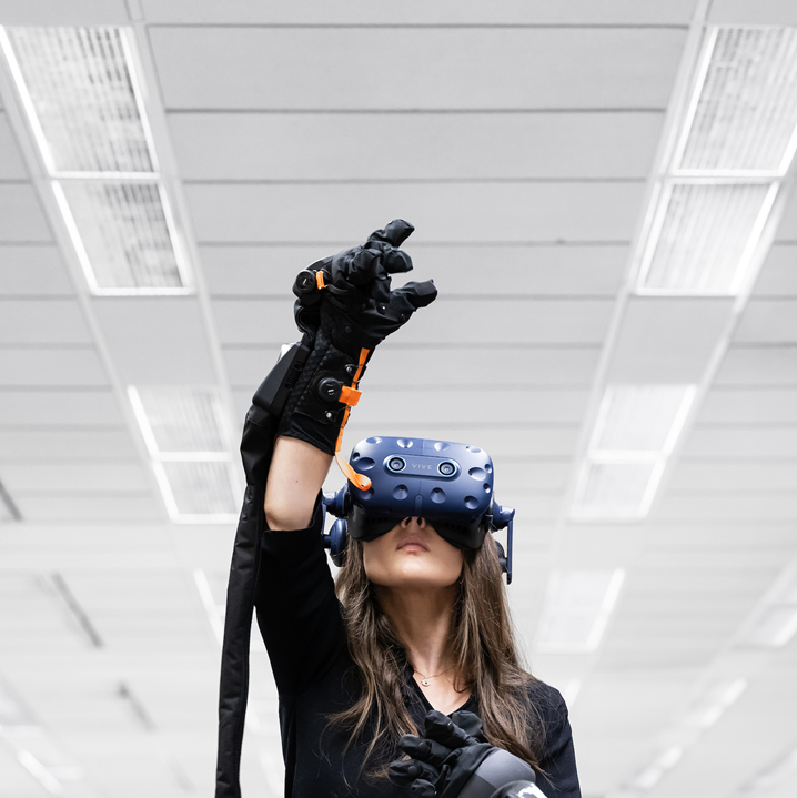 student wearing virtual reality glove and headset