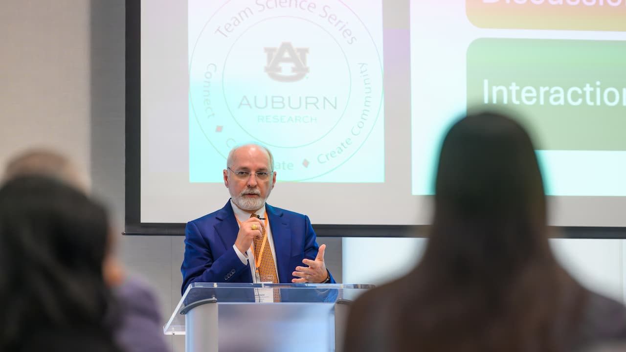 Dr. Steve Taylor speaking at a podium