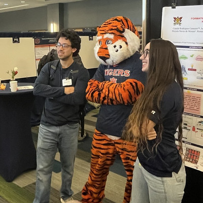 Aubie with symposium attendees