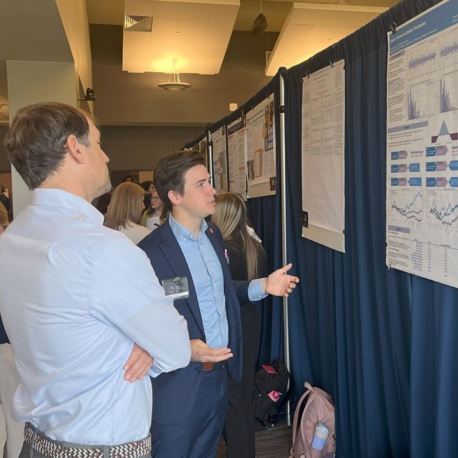 Hunter Cyr giving poster presentation